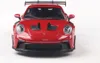 A red toy car, a Porsche 911 GT3 RS, is shown from the front against a white background. Produktbild-Vorschau