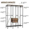 An open wardrobe with shelves, a hanging rod, and drawers, with weight capacity labels indicating load bearing for different parts. Produktbild-Vorschau