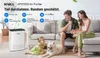 A family with a dog in a living room with an air purifier. Produktbild-Vorschau