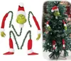 A collage showing a Grinch-themed Christmas tree decoration set laid out and then assembled on a Christmas tree. Produktbild-Vorschau
