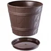 A brown plastic planter with a wood-like texture and a matching saucer, shown against a white background. Podgląd zdjęcia produktu