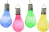 Four colorful light bulbs with internal string lights, arranged in a row against a white background. Produktbild-Vorschau