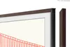 A close-up view of a TV frame with a decorative element and a separate frame piece. Voir les images du produit