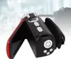 A black and red camcorder with its screen open, set against a blurred background. Podgląd zdjęcia produktu