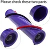 A close-up of a purple vacuum cleaner brush roll with red bristles, with two magnified circular insets showing details of the ends of the brush roll. Produktbild-Vorschau