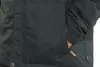 A close-up shot of a dark navy jacket pocket with a hand inside. Produktbild-Vorschau