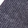 A close-up view of a gray ribbed doormat. Anteprima dell’immagine prodotto