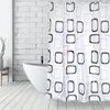 A shower curtain with a geometric pattern is shown hanging in a bathroom next to a bathtub. Náhled obrázku produktu