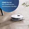A white robot vacuum cleaner is shown on a wooden floor, with a blue overlay containing text about its features. Voir les images du produit
