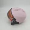 A pink helmet with a brown visor is shown against a white background. Anteprima dell’immagine prodotto