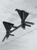 A black pull-up bar mounted on a concrete ceiling. Produktbild-Vorschau