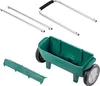 The image shows the disassembled parts of a garden spreader, including the main hopper with wheels, a handle assembly, and a front cover. Podgląd zdjęcia produktu