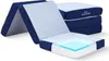 A folded mattress is shown with a cutaway view revealing its layers. Voir les images du produit