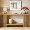 A console table with decorative items and a lamp, set against a textured wall. Podgląd zdjęcia produktu