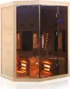 A corner view of a modern infrared sauna cabin made of light-colored wood and glass. Produktbild-Vorschau
