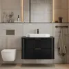 A modern bathroom vanity with a sink, faucet, and toilet. Anteprima dell’immagine prodotto