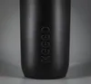 A close-up of a black bottle with embossed text. Produktbild-Vorschau