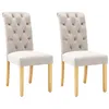 Two beige upholstered dining chairs with wooden legs are shown against a white background. Produktbild-Vorschau