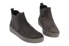 A pair of gray Chelsea boots with a thick sole, shown from a slightly elevated side angle against a white background. Produktbild-Vorschau