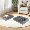 Two puppies sleeping on dog beds in a living room. Voir les images du produit