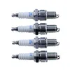 Four spark plugs are arranged vertically against a white background. Náhled obrázku produktu