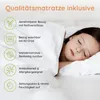 A child sleeping on a mattress, with feature callouts on the left. Produktbild-Vorschau