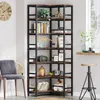 A corner bookshelf filled with various decorative items and books, placed in a room with a chair and a window. Produktbild-Vorschau