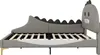 A side view of a child's bed with a dinosaur-shaped headboard. Produktbild-Vorschau
