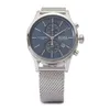 A close-up, front-facing shot of a Hugo Boss men's watch with a blue dial and silver mesh strap, set against a plain white background. Produktbild-Vorschau