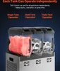 A triple-tank slush machine with one tank filled with red slush. Voir les images du produit