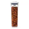 A clear, well-lit studio shot of a tall, rectangular food storage container filled with almonds. Produktbild-Vorschau