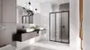 A modern bathroom with a double vanity, a large mirror, and a glass shower enclosure. Anteprima dell’immagine prodotto