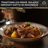 A close-up of a bowl of goulash with text overlay and a logo. Produktbild-Vorschau