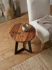 Runder Holztisch aus indischem Rosenholz 35x37 cm von oben betrachtet auf sandfarbenem Wollteppich neben einer skulpturalen Travertin-Stehlampe._#sku_BARWL5.665# Produktbild-Vorschau