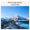 A scenic view of snow-capped mountains and a lake under a clear blue sky. Produktbild-Vorschau