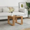 A living room scene with a sofa, coffee table, and plant. Podgląd zdjęcia produktu
