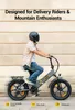 A person riding a gray electric bicycle on a sidewalk with a textured wall in the background. Produktbild-Vorschau