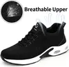 A black athletic shoe with a white sole, highlighted with text and graphics indicating breathability. Produktbild-Vorschau