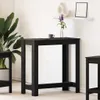 A black bar table is shown in a room with a plant and a shelf with decor. Produktbild-Vorschau