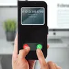 A person is holding a black flip cover for an iPhone, showing a simulated incoming call screen. Anteprima dell’immagine prodotto