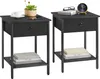 Two black nightstands are shown side-by-side against a white background. Each nightstand has a drawer and a lower shelf. Produktbild-Vorschau