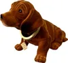 A plush toy dog with a collar and tag. Produktbild-Vorschau