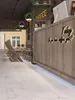Interior of a modern cafe with a wooden counter and seating area. Produktbild-Vorschau
