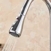 A close-up shot of a kitchen faucet with water spraying from the nozzle. Náhľad obrázku produktu