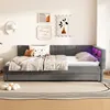 A bedroom scene with a daybed, bedding, and wall art. Anteprima dell’immagine prodotto