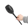A hand holding a solar-powered garden torch. Produktbild-Vorschau