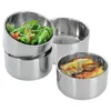Four stainless steel food containers, two filled with food, are arranged on a white background. Podgląd zdjęcia produktu
