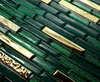 A close-up view of green and gold mosaic tiles. Náhľad obrázku produktu