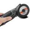 A hand holding a cordless angle grinder with a cutting wheel attached. Produktbild-Vorschau