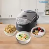 A Zojirushi rice cooker is shown with three bowls of food: cooked rice, congee with vegetables, and yogurt with berries and granola. Produktbild-Vorschau